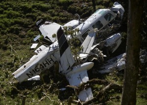 View of the wreckage of a Piper PA-60 Aerostar twin-engine aircraft that crashed on the eve,  on September 12, 2015 near San Pedro de los Milagros , east from Medellin, Antioquia department, Colombia  on September 12, 2015. killing two crew members and injuring another. Two people died when a plane carrying crew members from a film starring Tom Cruise crashed in Colombia, aviation authorities and Universal Pictures said. AFP PHOTO / Raul ARBOLEDA